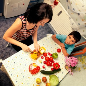 http://www.dreamstime.com/stock-image-mother-son-child-cut-vegetables-meal-food-kitchen-image30615621